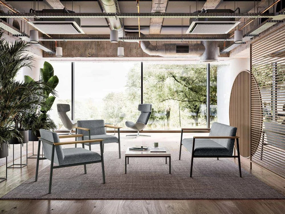 Ado Chair With Wooden Armrests In Grey With Grey Sofa And Low Coffee Table In Lounge Area