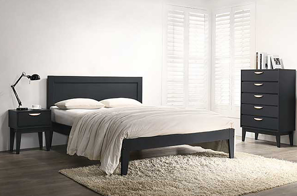 Alanna Bedside Table Navy with Bed and Table Lamp in Bedroom Setting