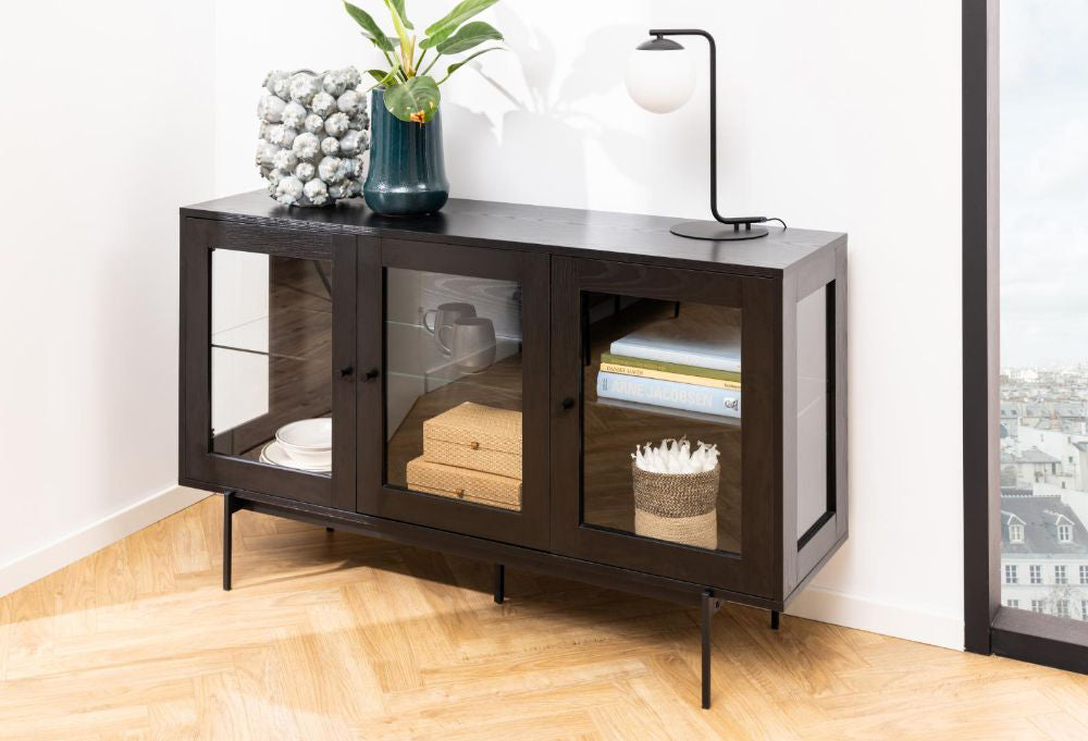 Angie 3 Door Sideboard in Black Finish with Books Inside and Table Lamp on Top in Dining Setting