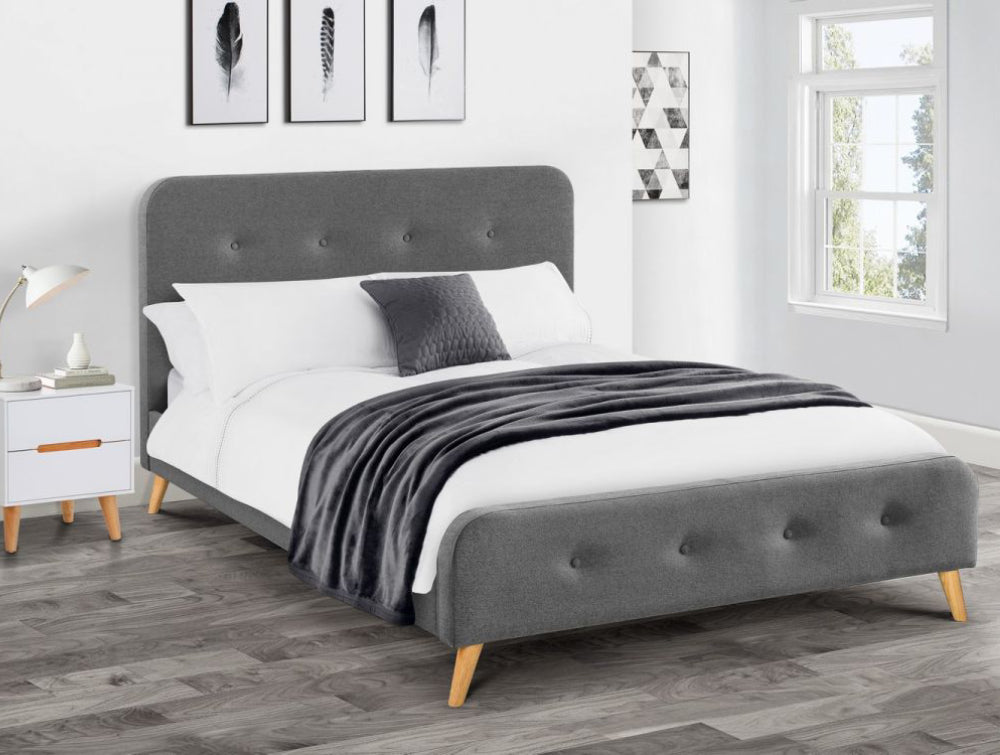 Asta Curved Retro Fabric Grey Bed with Table Lamp and Wall Art in Bedroom Setting