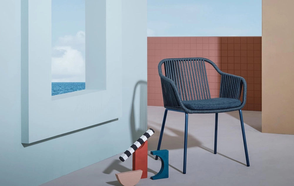 Babila Twist Dining Chair with Armrests in Blue Finish Outdoor Setting