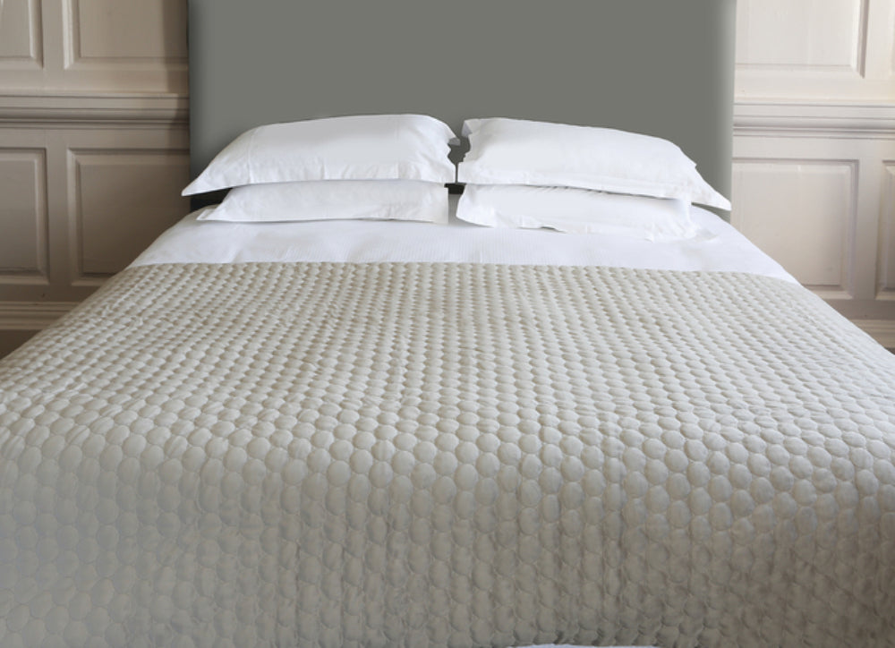 Bedspread Geometric Throw in Taupe Finish with Pillows in Bedroom Setting