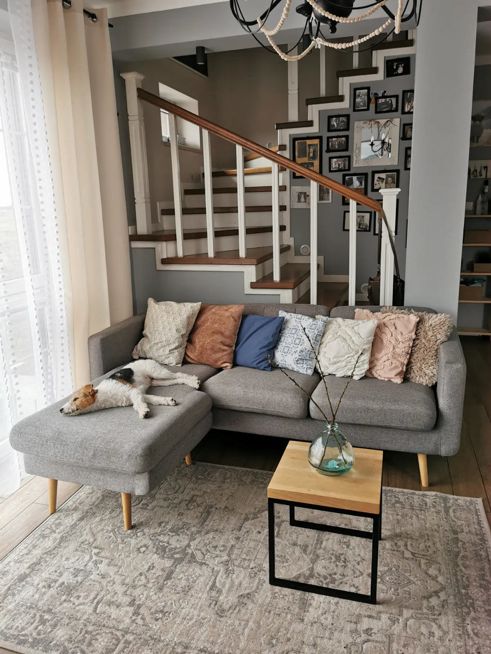 Brent Chaise Sofa in Grey Finish with Coffee Table and Floor Rug in Living Room Setting