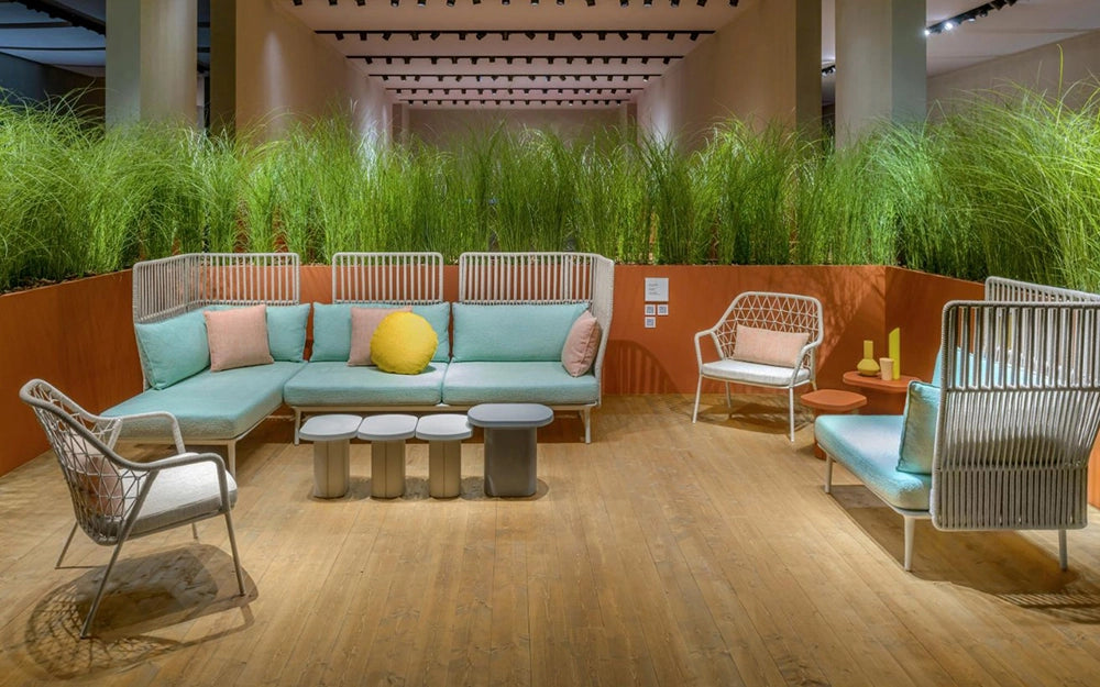 Caementum Monobloc Coffee Table in Grey Finish with Corner Sofa and Lounge Chair in Breakout Setting