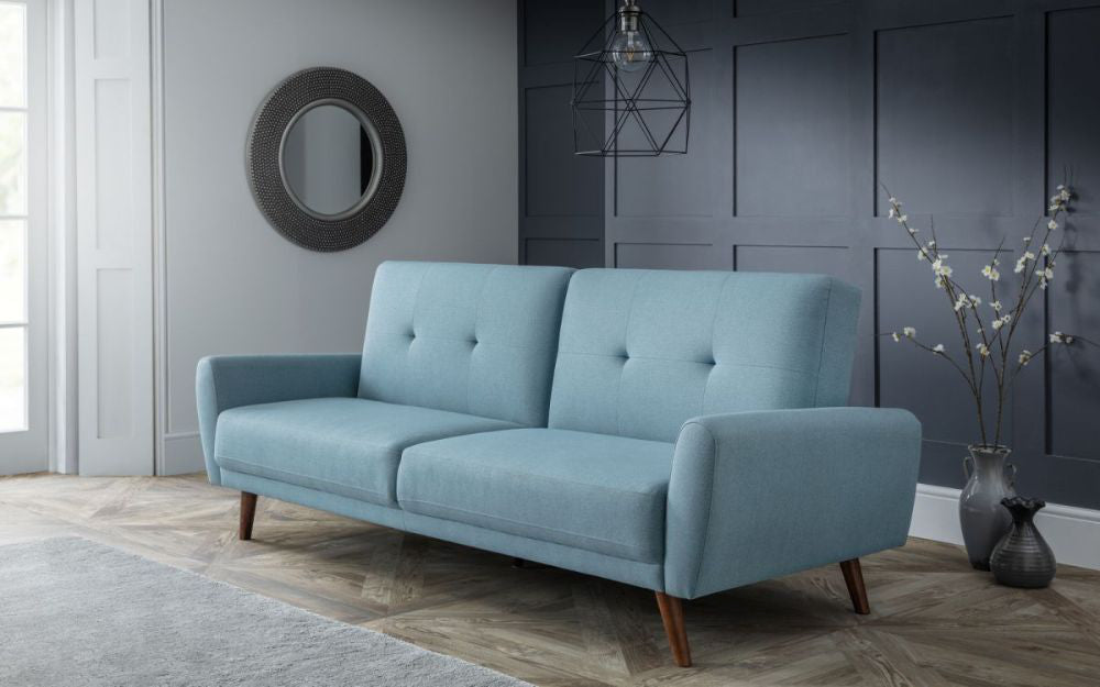 Capri Sofa Bed Blue with Flower Vase and Ceiling Light in Living Room Setting 2