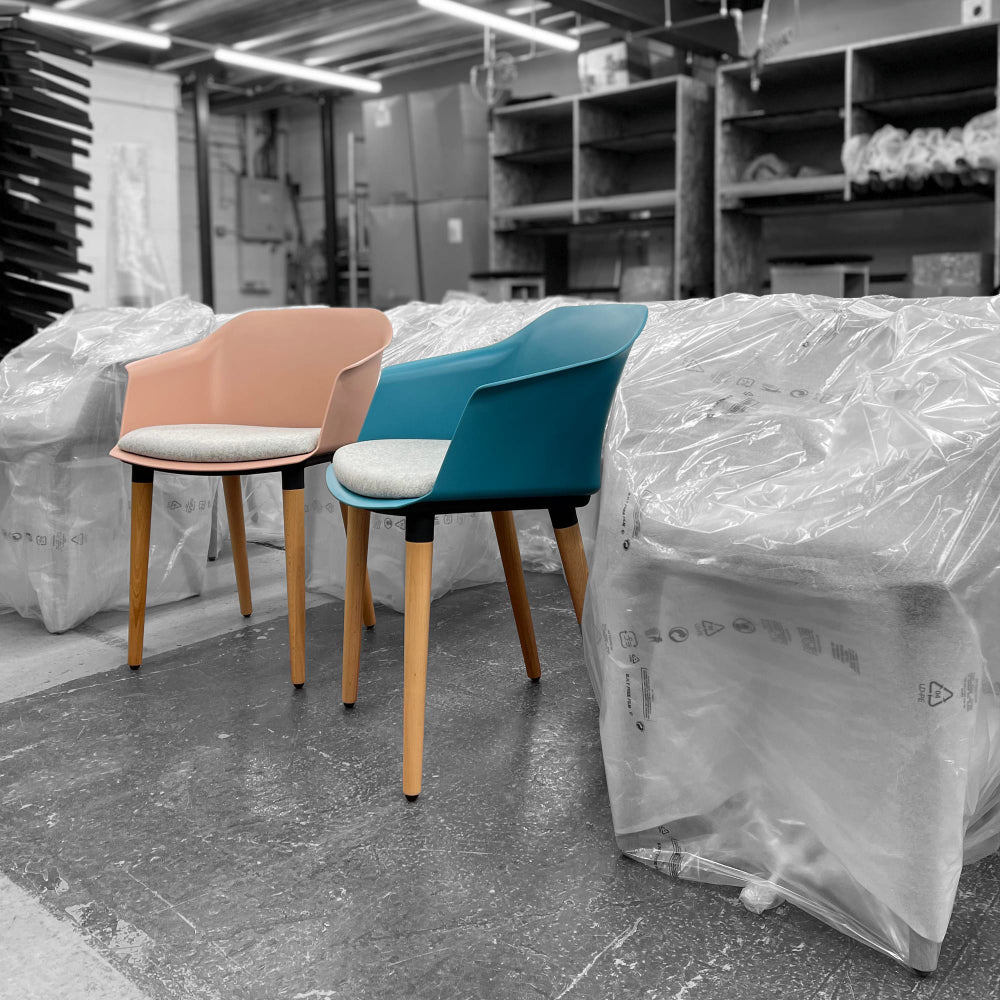 Capture Armchair with Seat Pad and 4 Wooden Legs in Two Toned Finish in Storage Setting