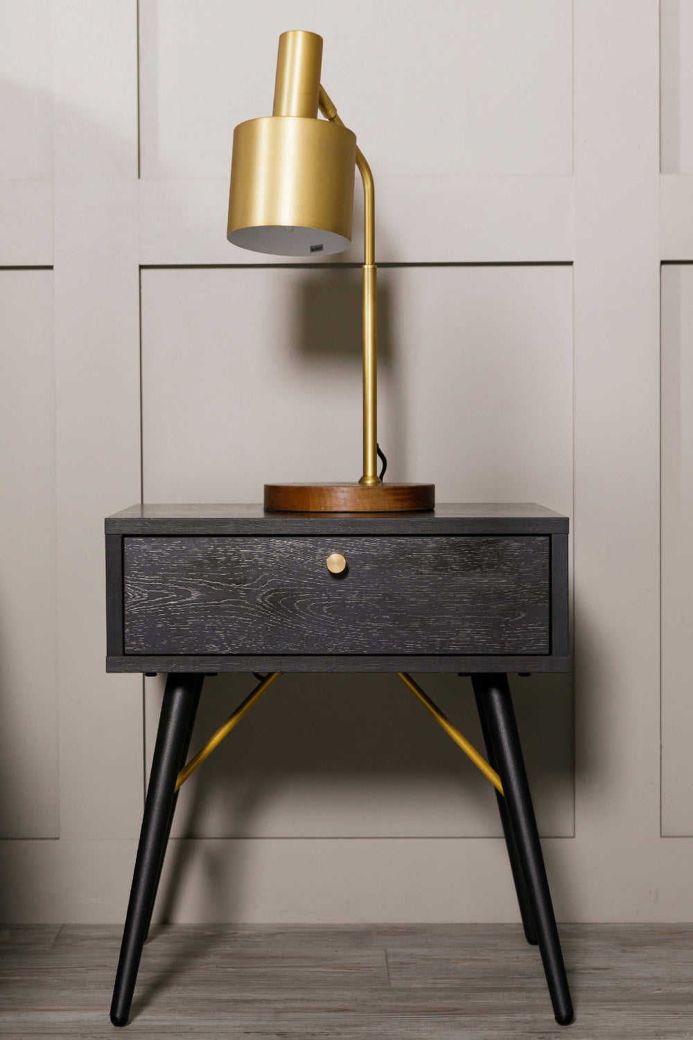 Casa 1 Drawer Bedside Table in Black and Copper Finish with Table Lamp in Living Room Setting