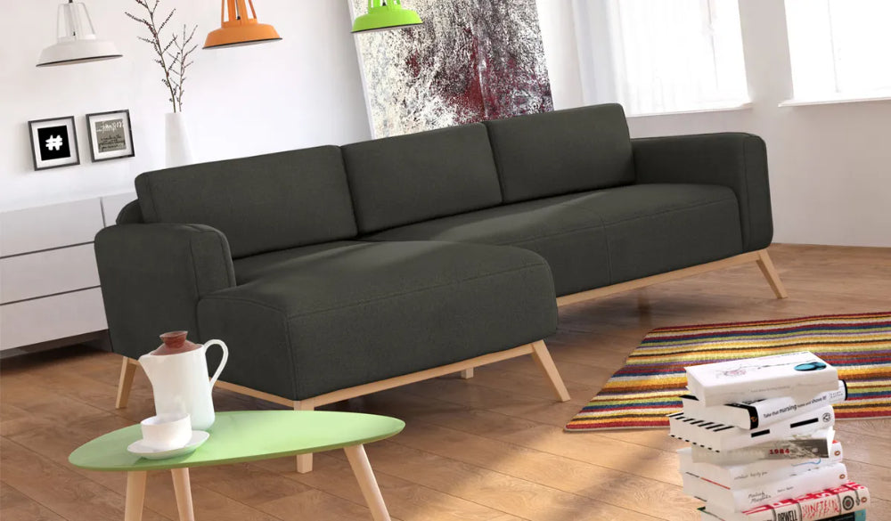 Chase Corner Sofa in Dark Grey Finish with Coffee Table and Floor Rug in Living Room Setting