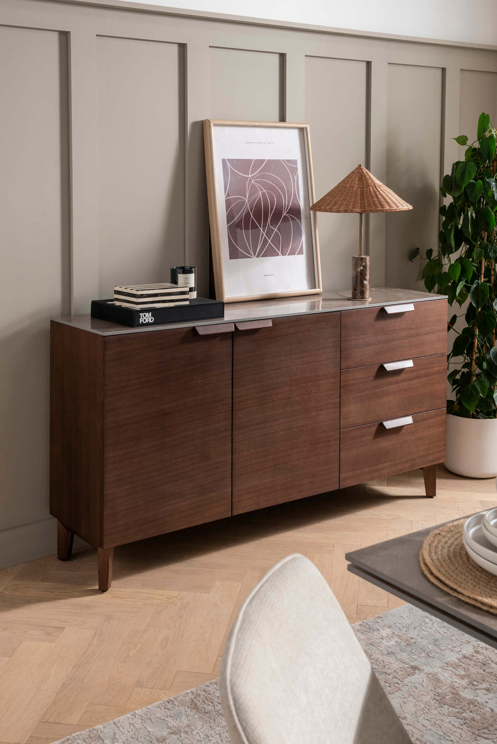 Corso Wooden Sideboard in Latte Finish with Indoor Plant and Chair in Dining Setting