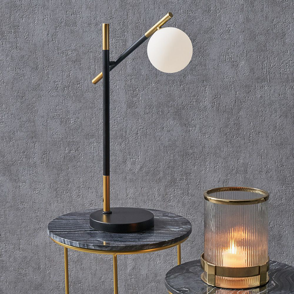 Dalia White Orb and Black Metal Table Lamp at the Top of the Side Table