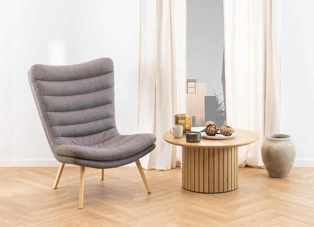 Dawson Resting Chair in Grey Finish with Round Top Wooden Coffee Table and Clay Pot in Living Room Setting