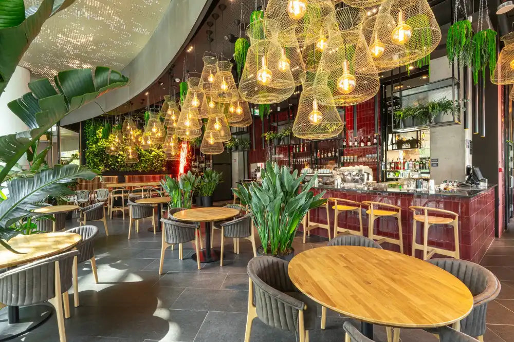 Evo Wooden Highstool with Round Tables and Chairs in Restaurant Setting