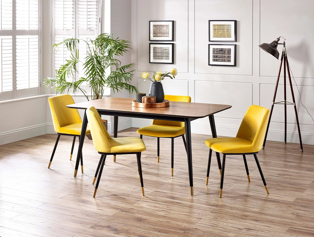 Fintan Rectangular Dining Table in Walnut and Black Finish with Pink Chair and Indoor Plant in Dining Setting