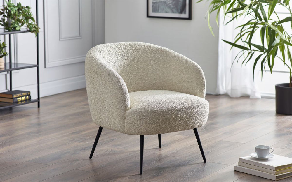 Hadid Accent Chair in Ivory Finish with Indoor Plant and Bookshelves in Living Room Setting