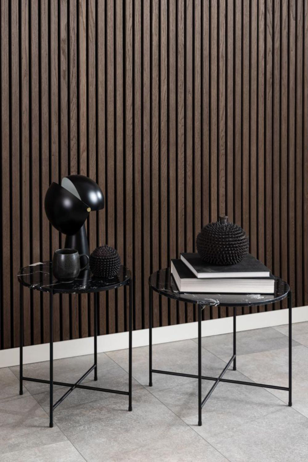 Harlie Marble Top Side Table in Black Finish with Books in Living Room Setting