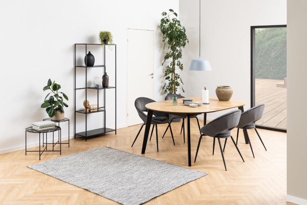Harlie Marble Top Side Table in Black Finish with Dining Table and Floor Rug in Living Room Setting