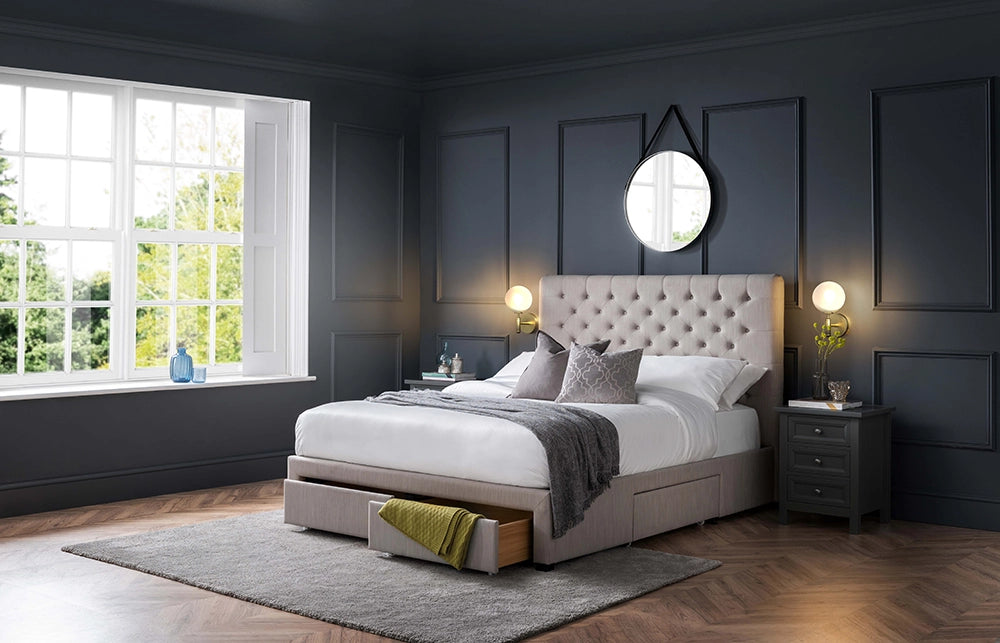 Hilton Deep Button 4 Drawer Bed in Grey Finish Linen with Wall Lamp and 3 Door Chest Drawer in Bedroom Setting