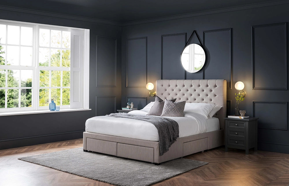 Hilton Deep Button 4 Drawer Bed in Grey Finish Linen with Wall Lamp and Pillow in Bedroom Setting