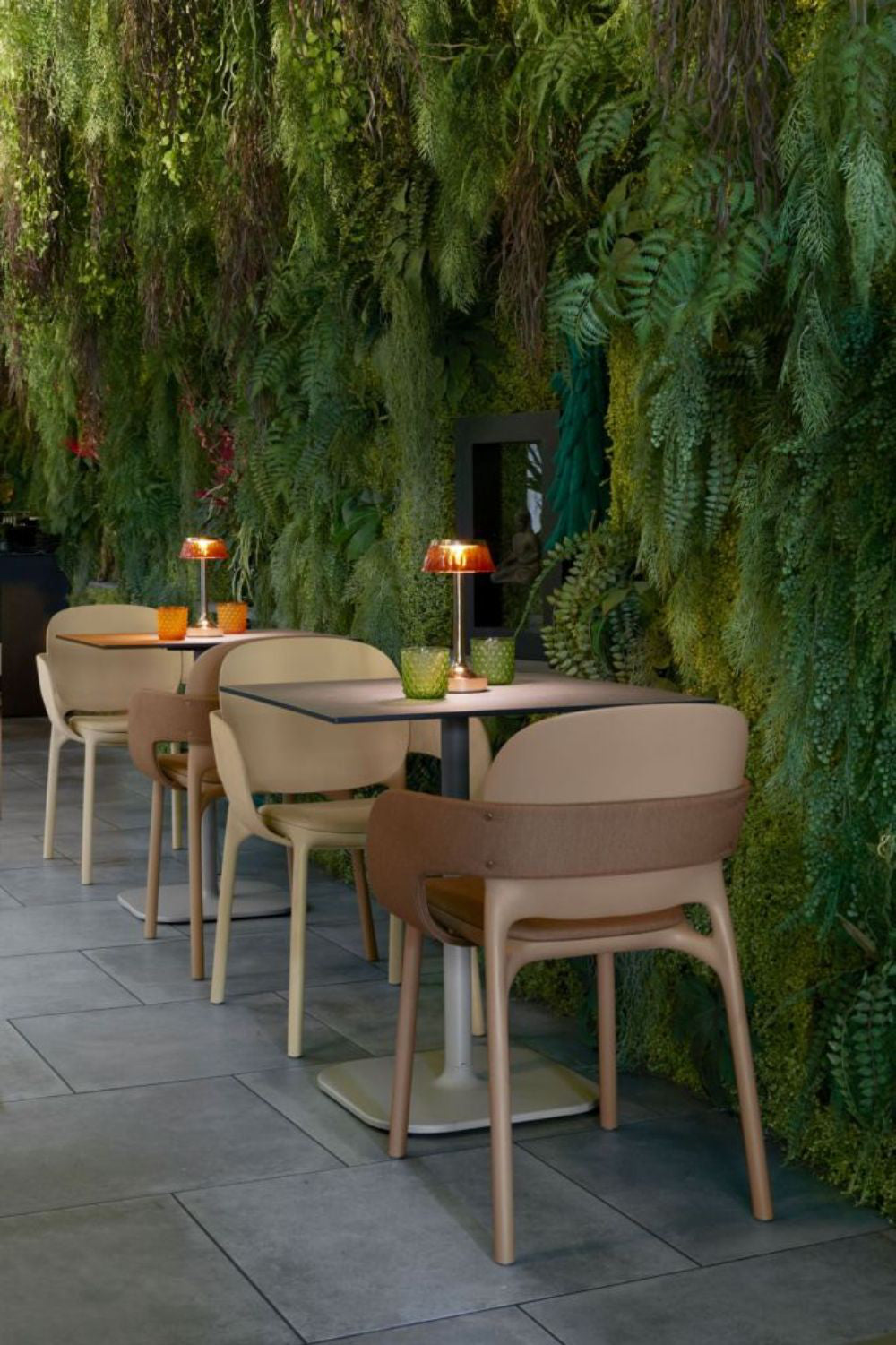 Hug Padded Armchair with Dining Table and Lampshade in Outdoor Setting