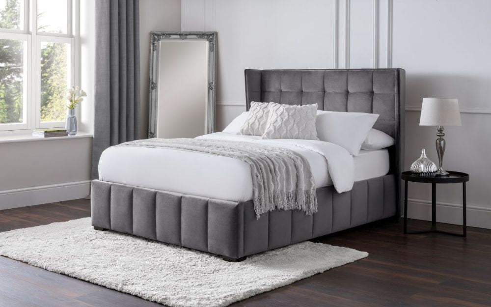 Jay Bedframe in Light Grey Finish with Pillows and Mirror in Bedroom Setting
