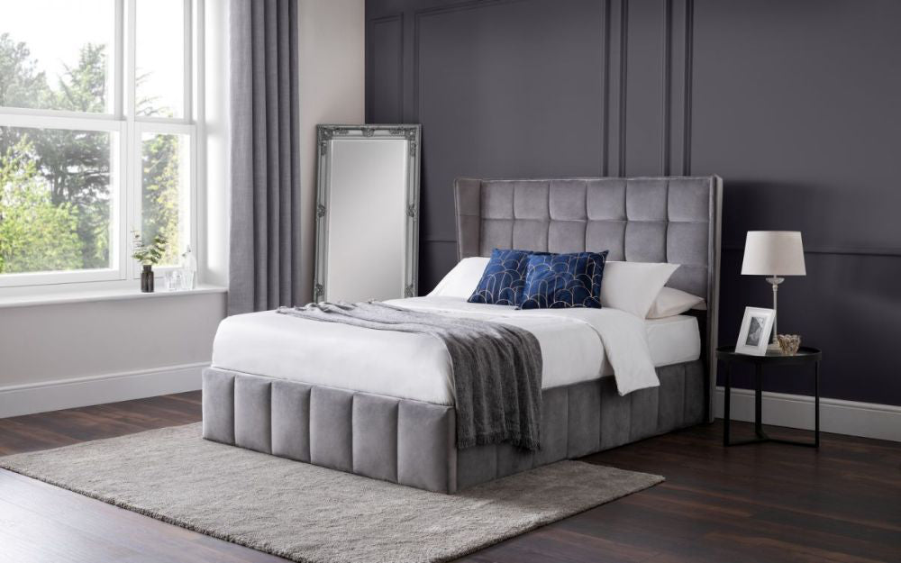 Jay King Sized Ottoman Bed in Light Grey Finish with Lampshade and Mirror in Bedroom Setting