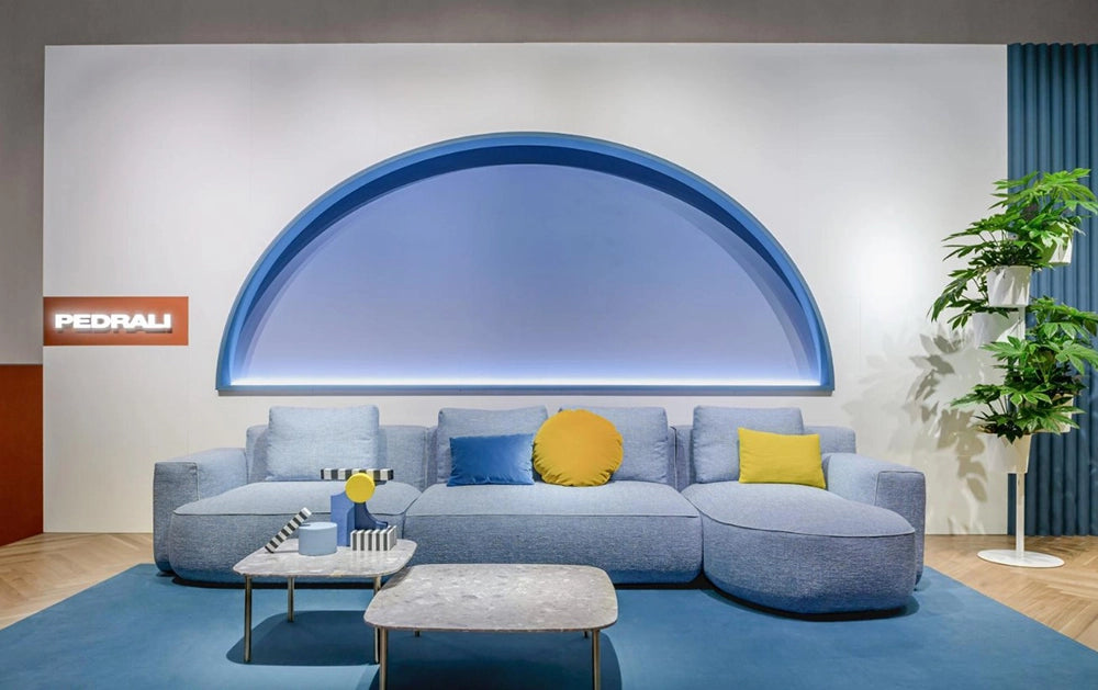 Jeff Corner Sofa with Chaise in Blue Finish with Coffee Table and Indoor Plant in Studio Setting