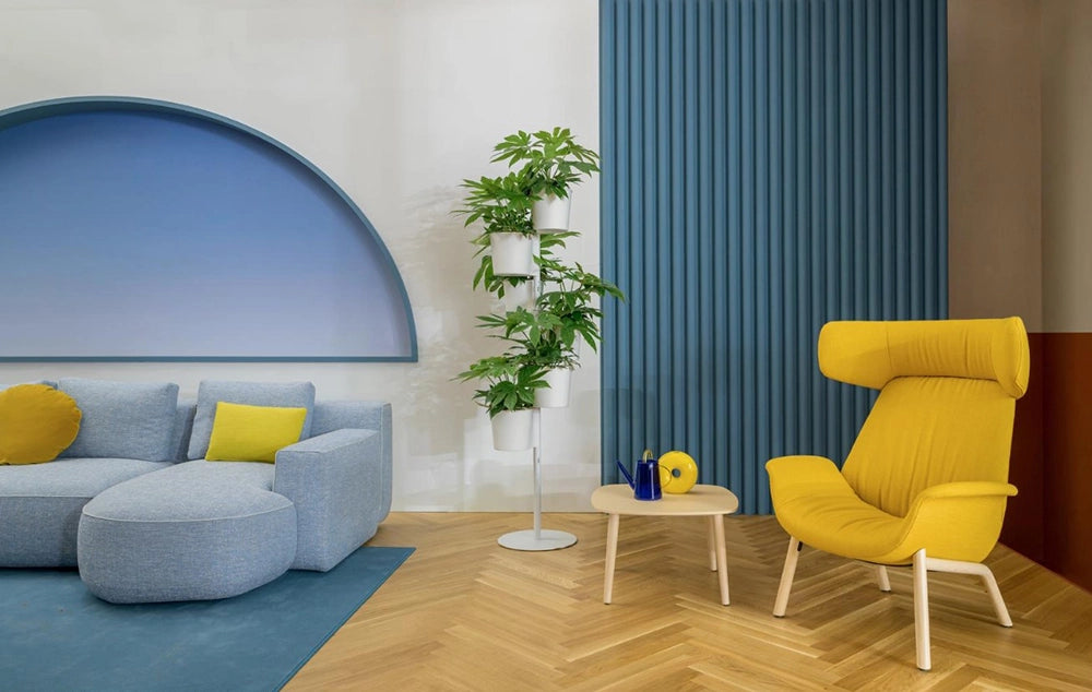 Jeff Corner Sofa with Chaise in Blue Finish with Coffee Table and Lounge Chair in Studio Setting