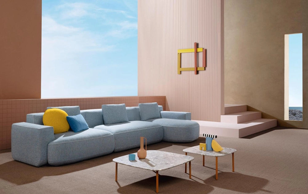 Jeff Corner Sofa with Chaise in Blue Finish with Square Top Coffee Table in Studio Setting