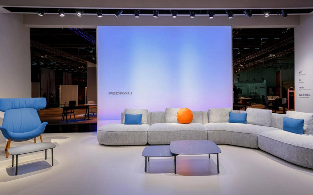 Jeff Corner Sofa with Chaise in Grey Finish with Coffee Table and Lounge Chair in Studio Setting