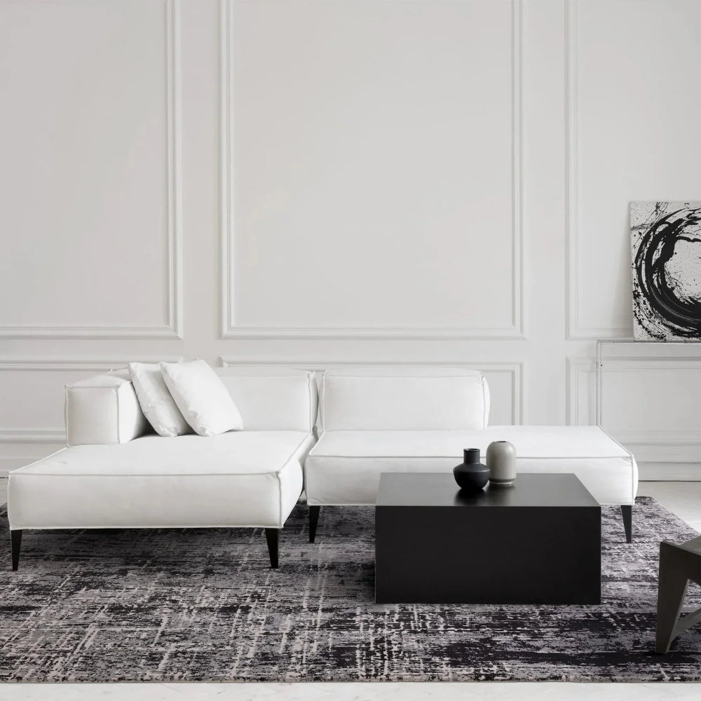 Kazzie Abstract Rug in Black Finish with Modular Sofa and Coffee Table in Living Room Setting