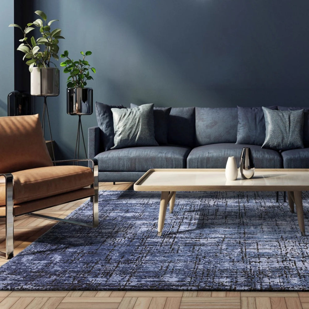 Kazzie Abstract Rug in Navy Finish with Coffee Table and Sofa in Living Room Setting