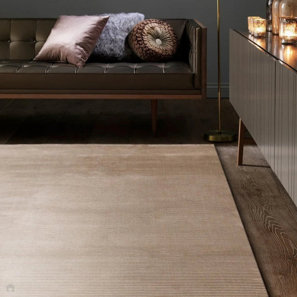 Kazzie Plain Stripe Rug in Beige Finish with Cupboard and Sofa in Living Room Setting