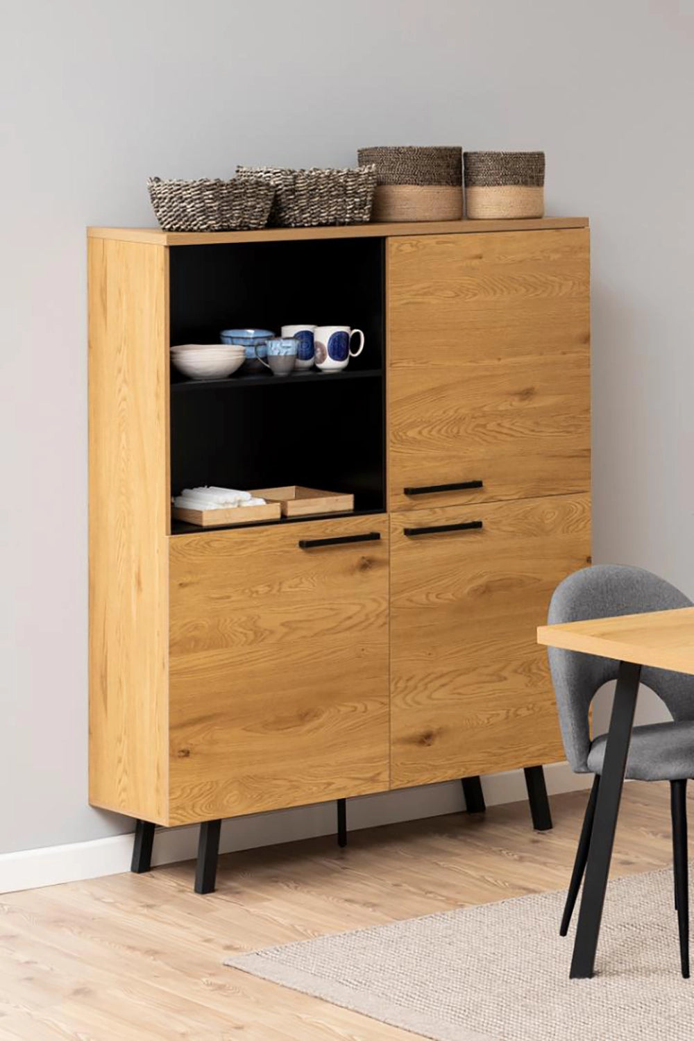Kiara Display Cabinet in Matte Oak Finish with Upholstered Chair and White Cup in Dining Setting