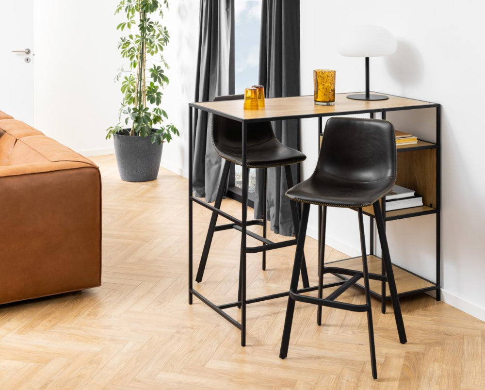 Leo Barstool with Footrest in Black Finish with Indoor Plant and Sofa in Living Room Setting 2