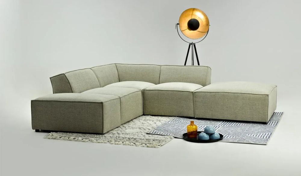 Max Corner Sofa in Mink Finish with Floor Lamp and Rug in Studio Setting