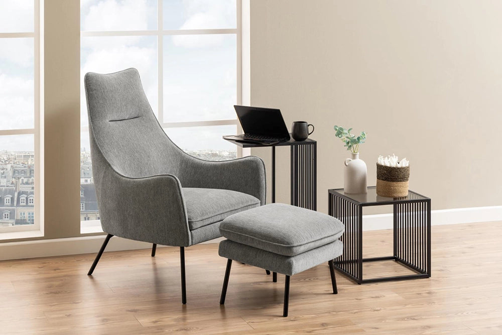 Melanie Side Table in Black Marble Finish with Upholstered Grey Lounge Chair and Pouf in Breakout Setting