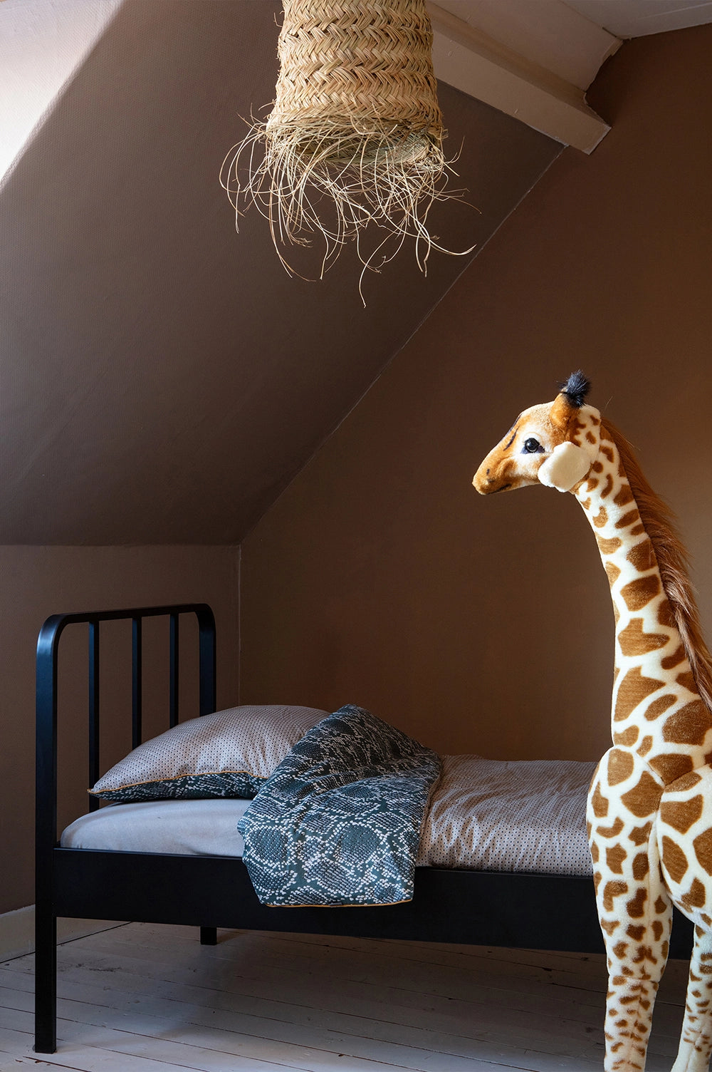 Mews Metal Bed Frame Black Mattress and Pillow with Stuffed Animal in Bedroom Setting