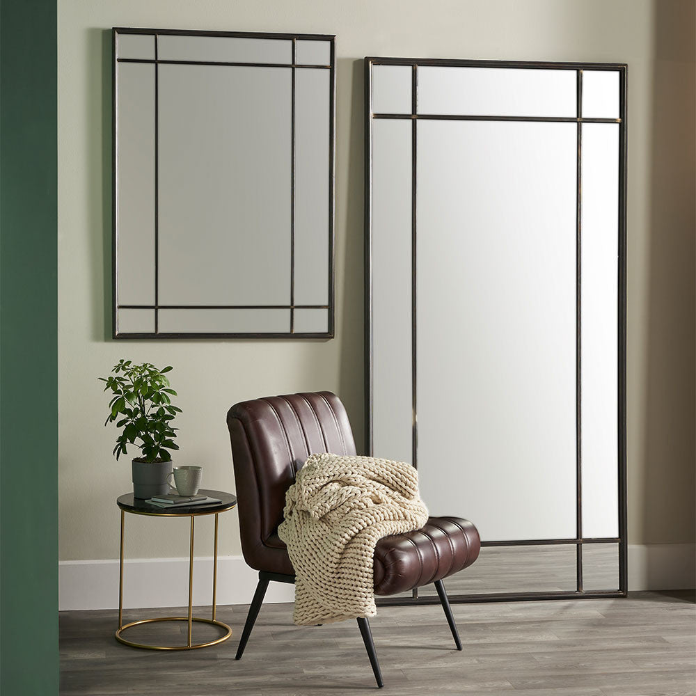 Miranda Antique Bronze Metal Rectangular Floor Mirror with Lounge Chair and Coffee Table in Living Room Setting