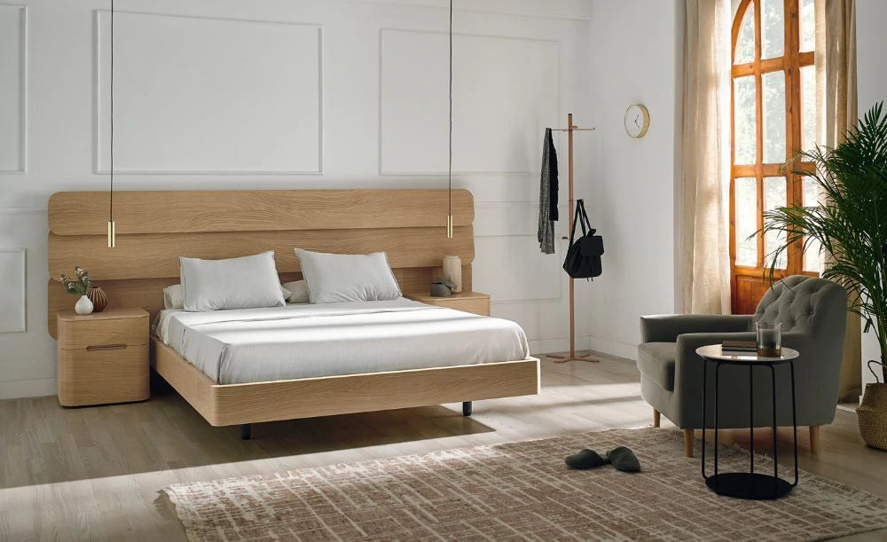 Mobenia Dodo Headboard in European Oak Finish with Matching Side Table and Grey Armchair in Bedroom Settings