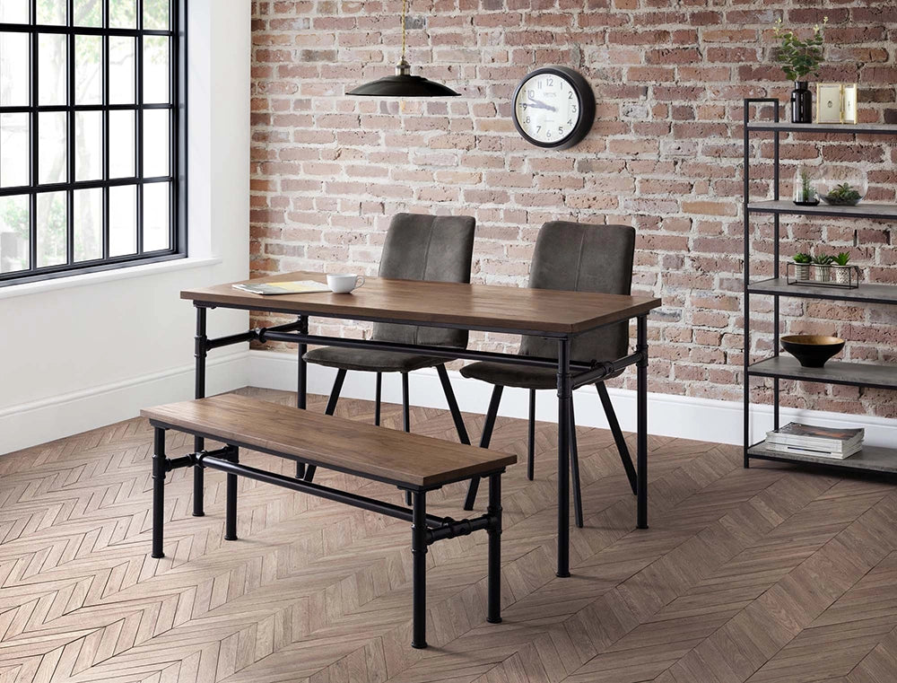 Naeve Industrial Dining Table in Wooden Top Finish with Wall Clock and Chair in Breakout Setting