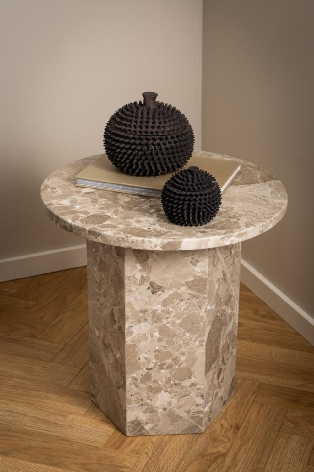 Naria Round Side Table in Latte Finish with Home Decors in Living Room Setting