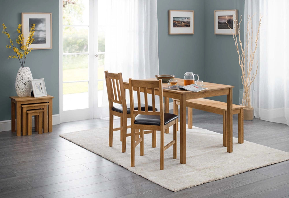 Orr Dining Chair in Oak Finish with Wooden Table and Nesting Tables in Living Room Setting
