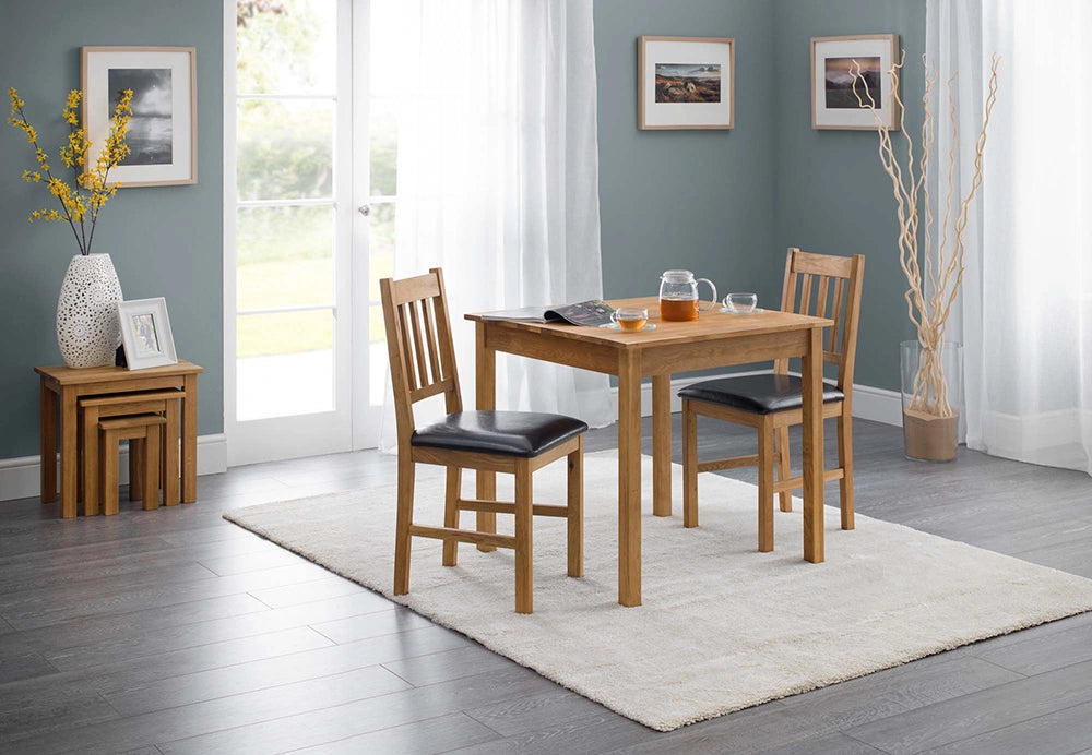 Orr Dining Chair in Oak Finish with Wooden Table and Transparent Cup in Living Room Setting