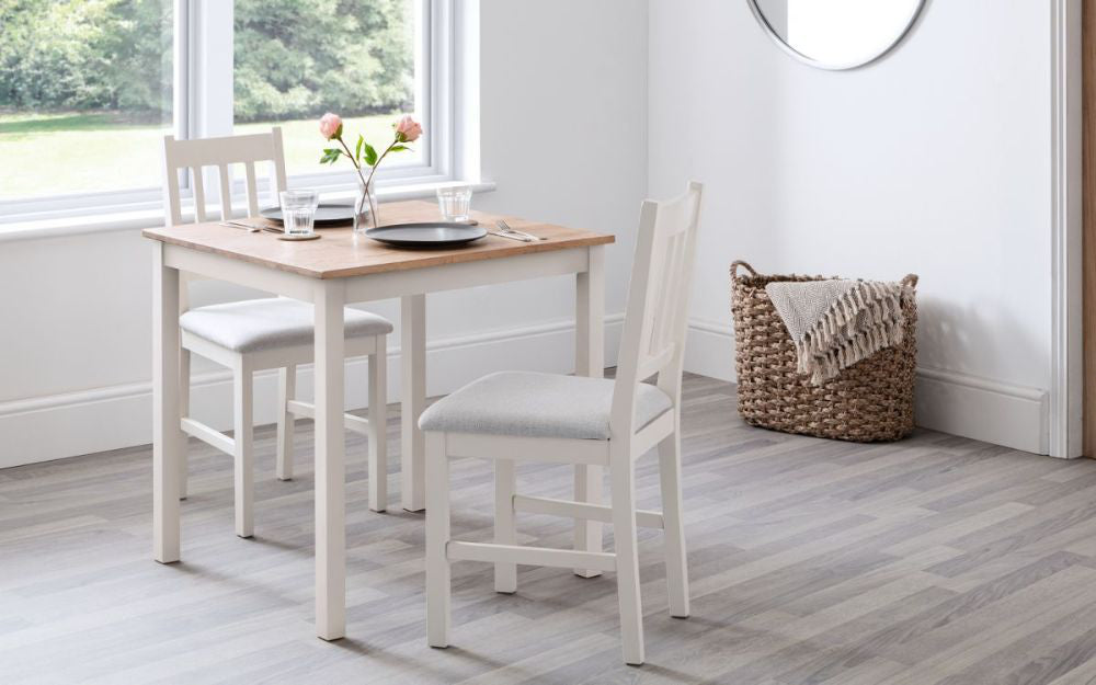 Orr Dining Table 750mm Ivory and Oak with Wooden Chairs and Wall Mirror in Dining Setting