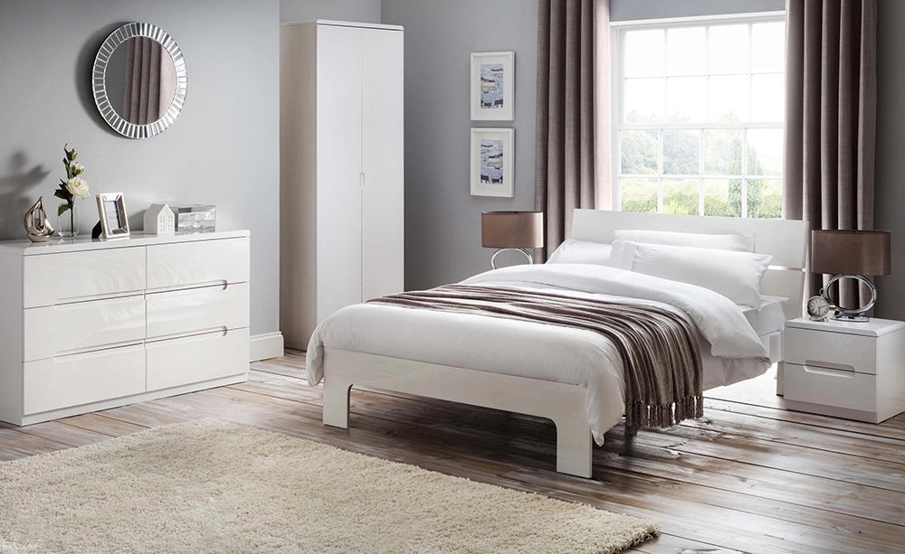 Parker 6 Drawer Wide Chest in White Finish with Wardrobe and Brown Lampshade in Bedroom Setting