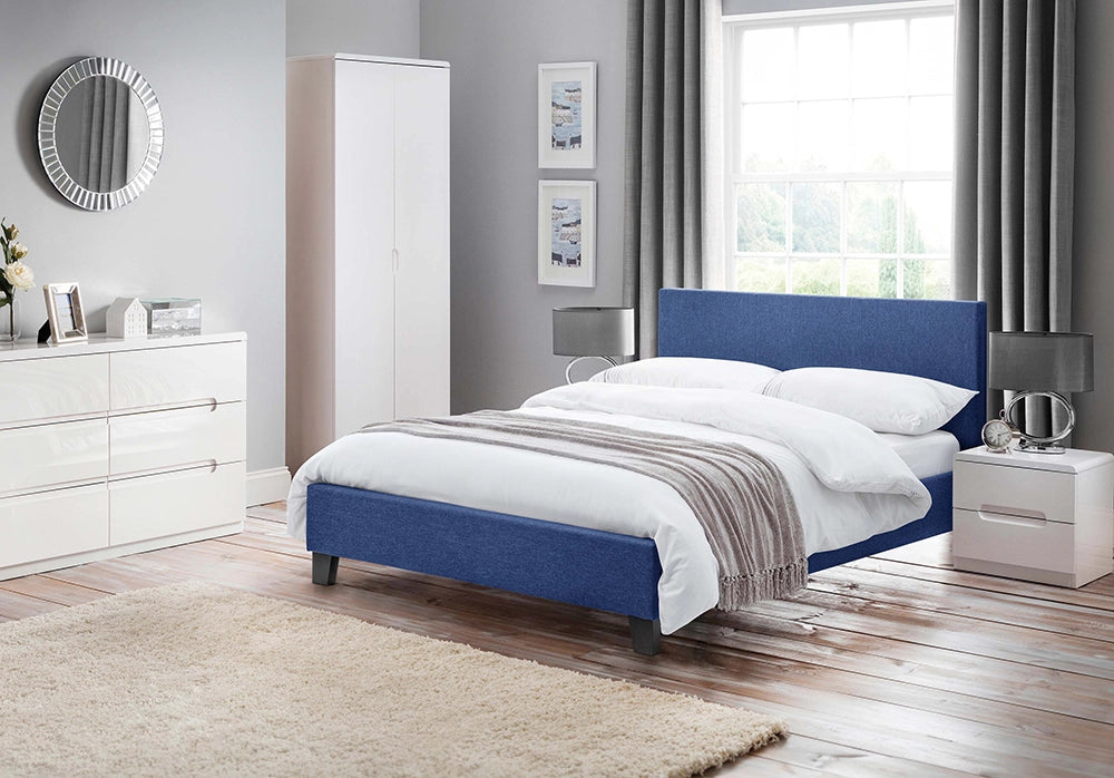 Parker 6 Drawer Wide Chest in White Finish with Wardrobe and Grey Lampshade in Bedroom Setting