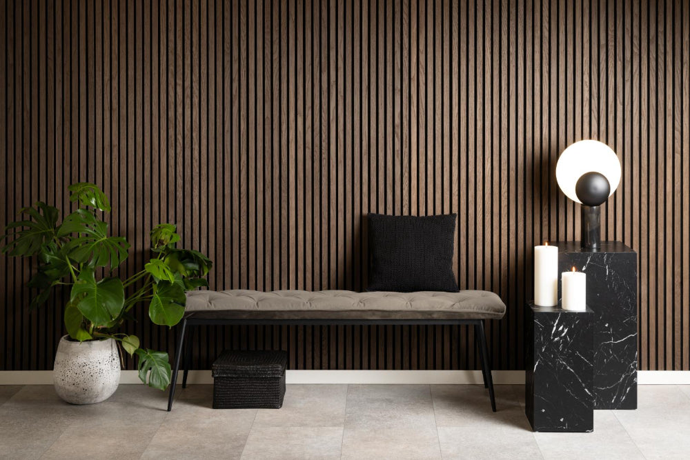 Rica Upholstered Bench in Beige Finish with Indoor Plant and Side Table in Breakout Setting