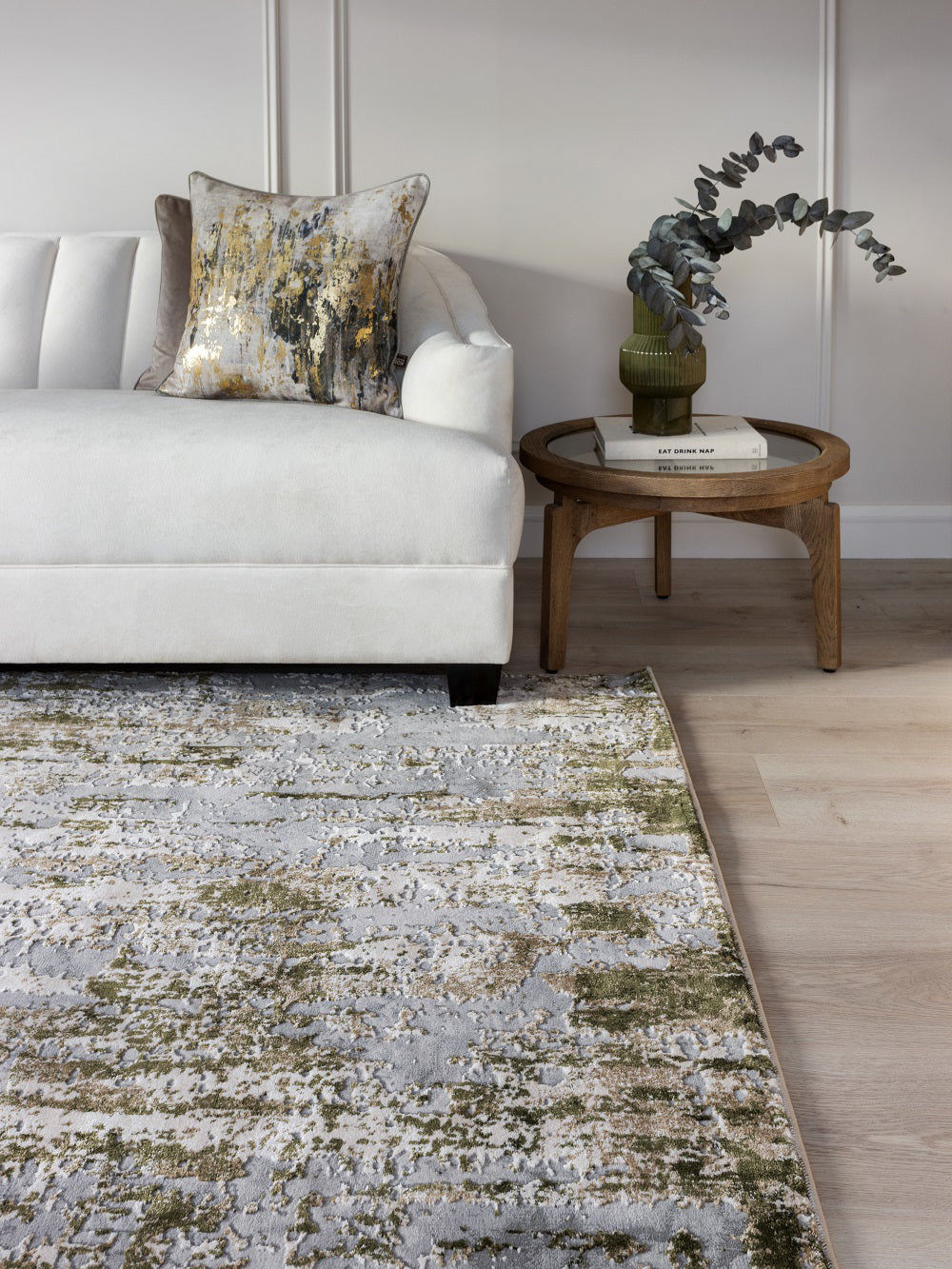 Riley Soft Rug in Moss Finish with Coffee Table and Pillows in Living Room Setting