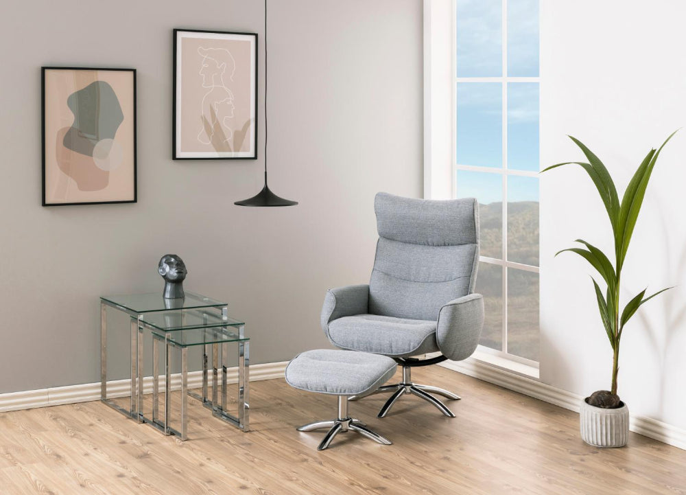 Riva Nest of 3 Tables Clear Glass with Grey Lounge Chair and Indoor Plant in Living Room Setting