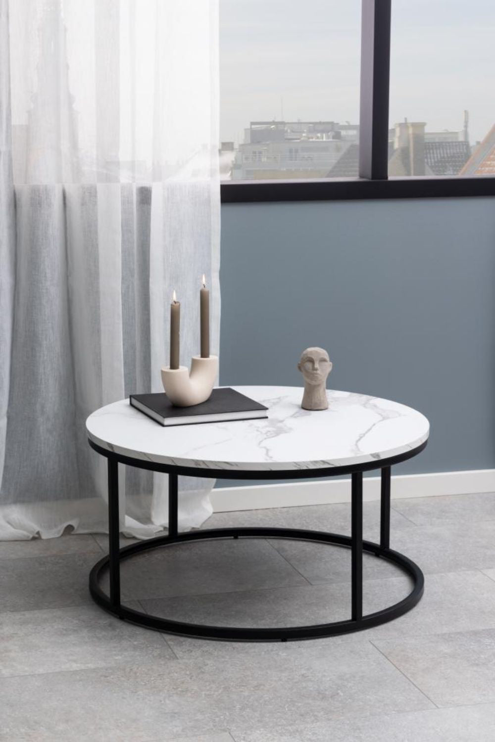 Riva Round Coffee Table White Marble with Candle Holder and Notebook in Breakout Setting